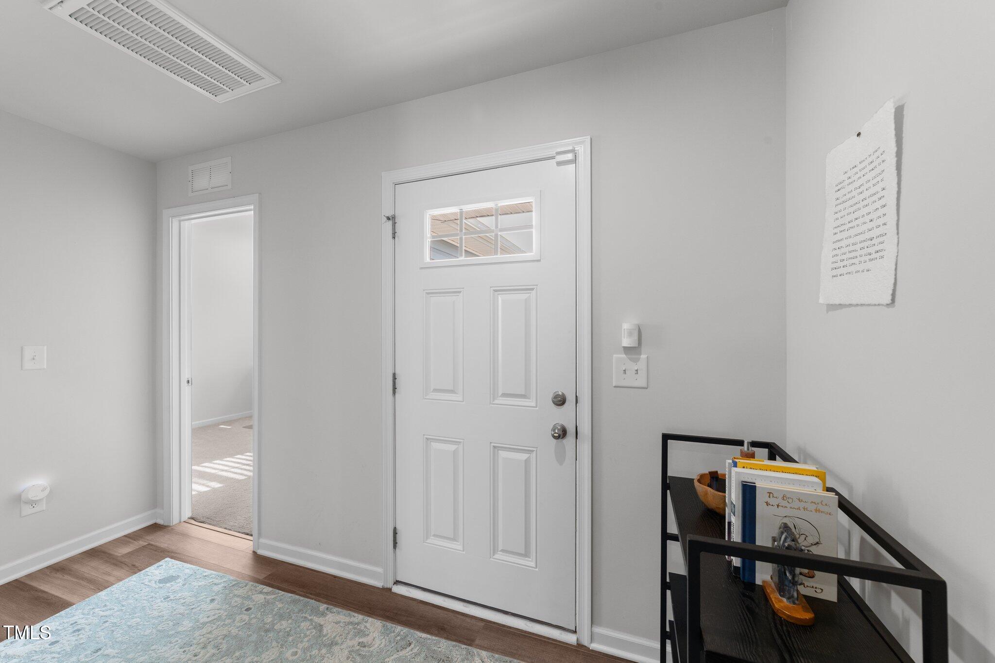 45 Florentine Court Angier, NC 27501 - Photo 27 of 27 a view of an entryway with wooden floor