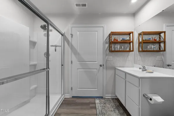 a bathroom with a sink toilet and mirror