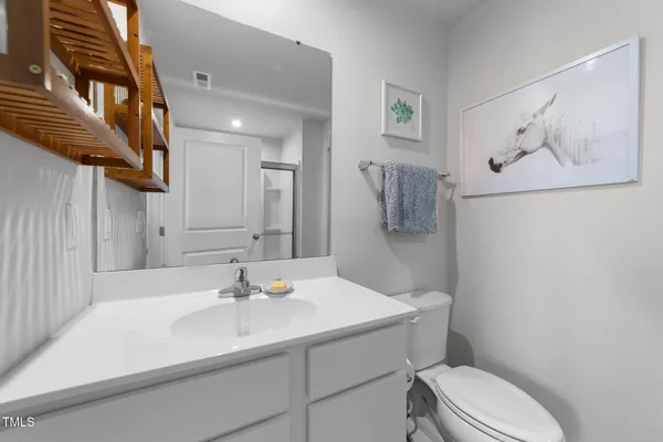 a bedroom with a large bed and a flat screen tv