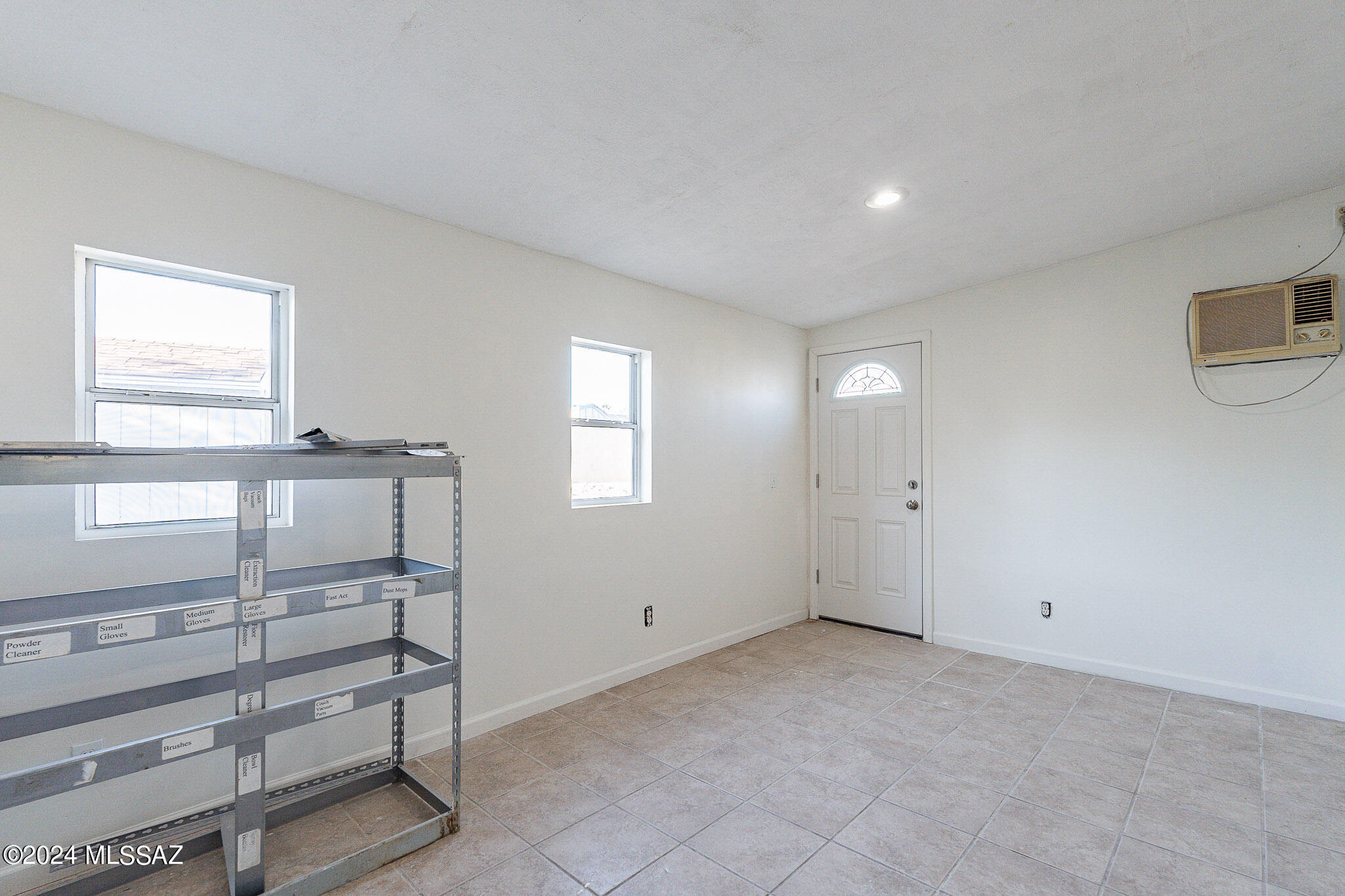 2690 West Sunset Road Tucson, AZ 85741 - Photo 23 of 33 a view of an empty room with a window
