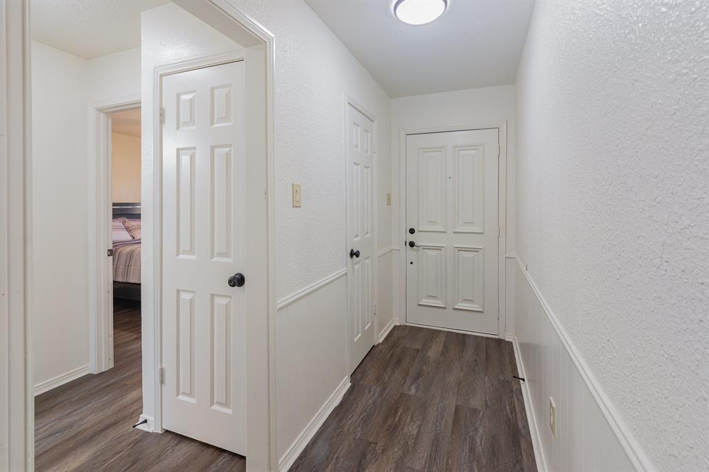 501 Field Street Colleyville, TX 76034 - Photo 13 of 36 a view of a hallway with wooden floor and closet