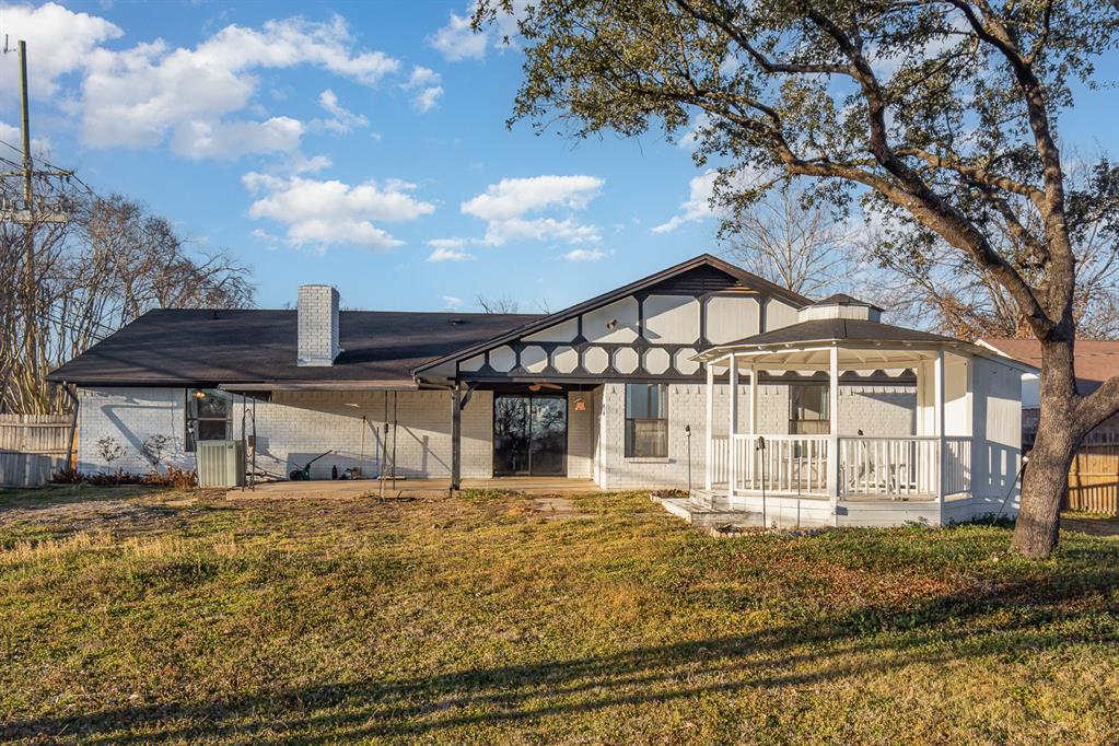 501 Field Street Colleyville, TX 76034 - Photo 34 of 36 a front view of a house with a yard