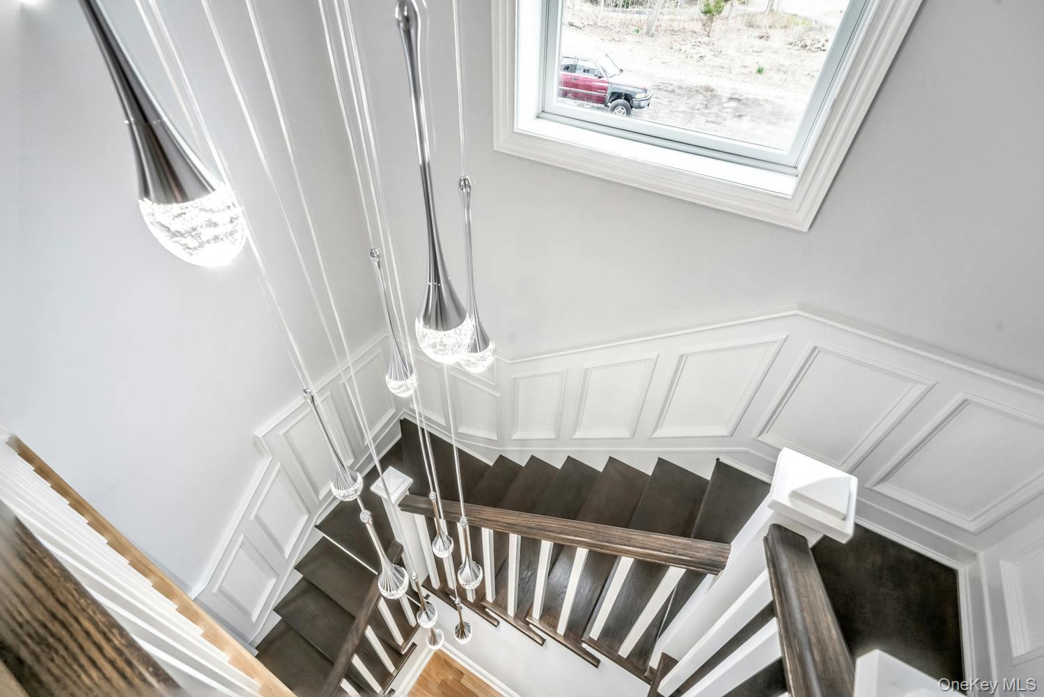539 Split Rock Road Syosset, NY 11791 - Photo 7 of 40 Staircase with a decorative wall