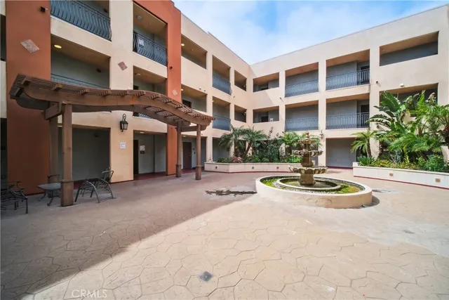 a view of an apartment with furniture and fire pit