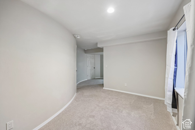 3863 East Cascade Road, Unit 3 Eagle Mountain, UT 84005 - Photo 29 of 37 Neutral-toned carpeting, recessed ceiling lighting, and a window with a white sill