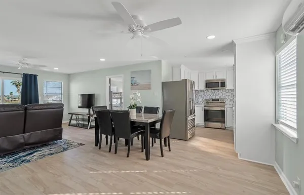 a dining room with furniture and window