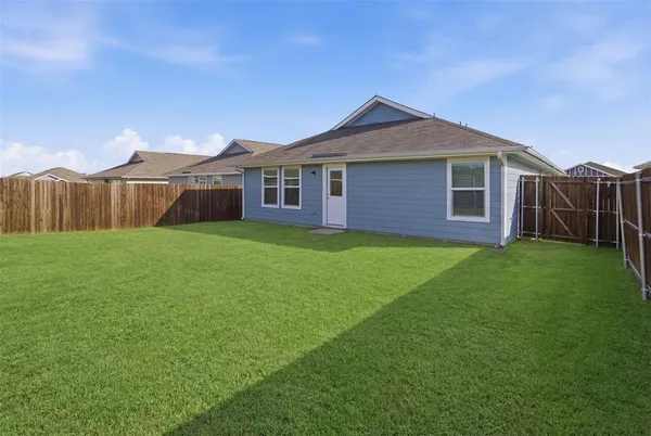 a view of a yard in front of a house with a yard