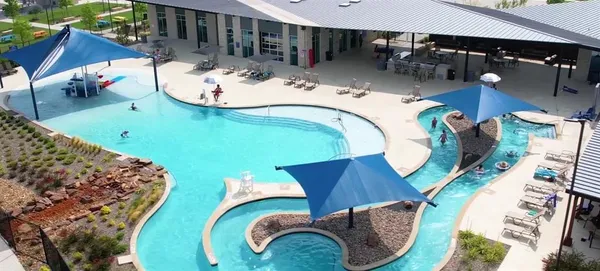 a swimming pool with barbeque oven