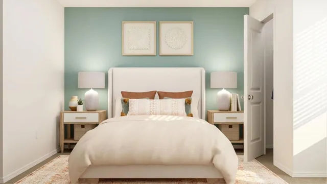 a bed room with a bed and a night stand