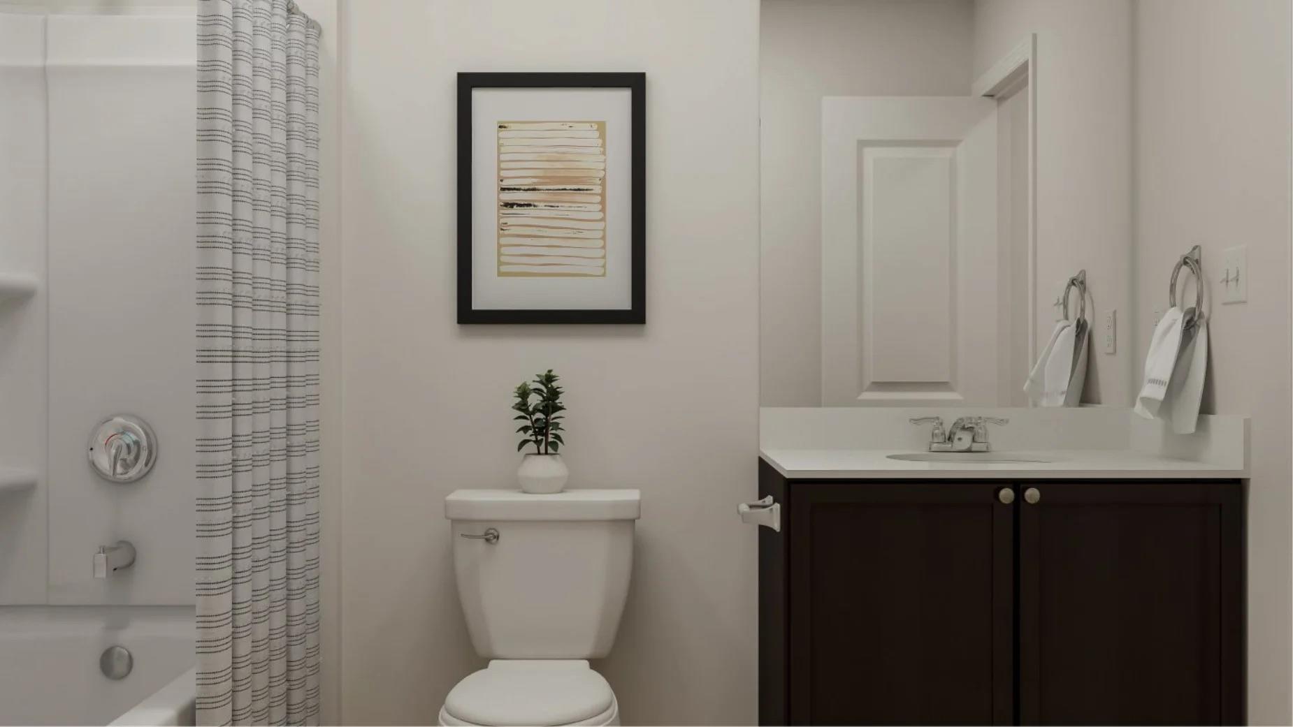 173 Bugbee Kyle, TX 78640 - Photo 17 of 17 a bathroom with a toilet sink and mirror