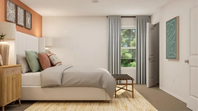 a living room with a bed and a window