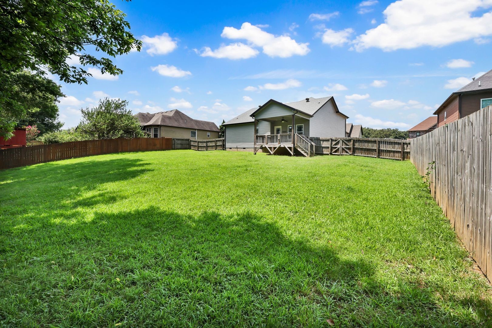 987 Promenade Drive Adams, TN 37010 - Photo 31 of 34 a front view of a house with yard and green space