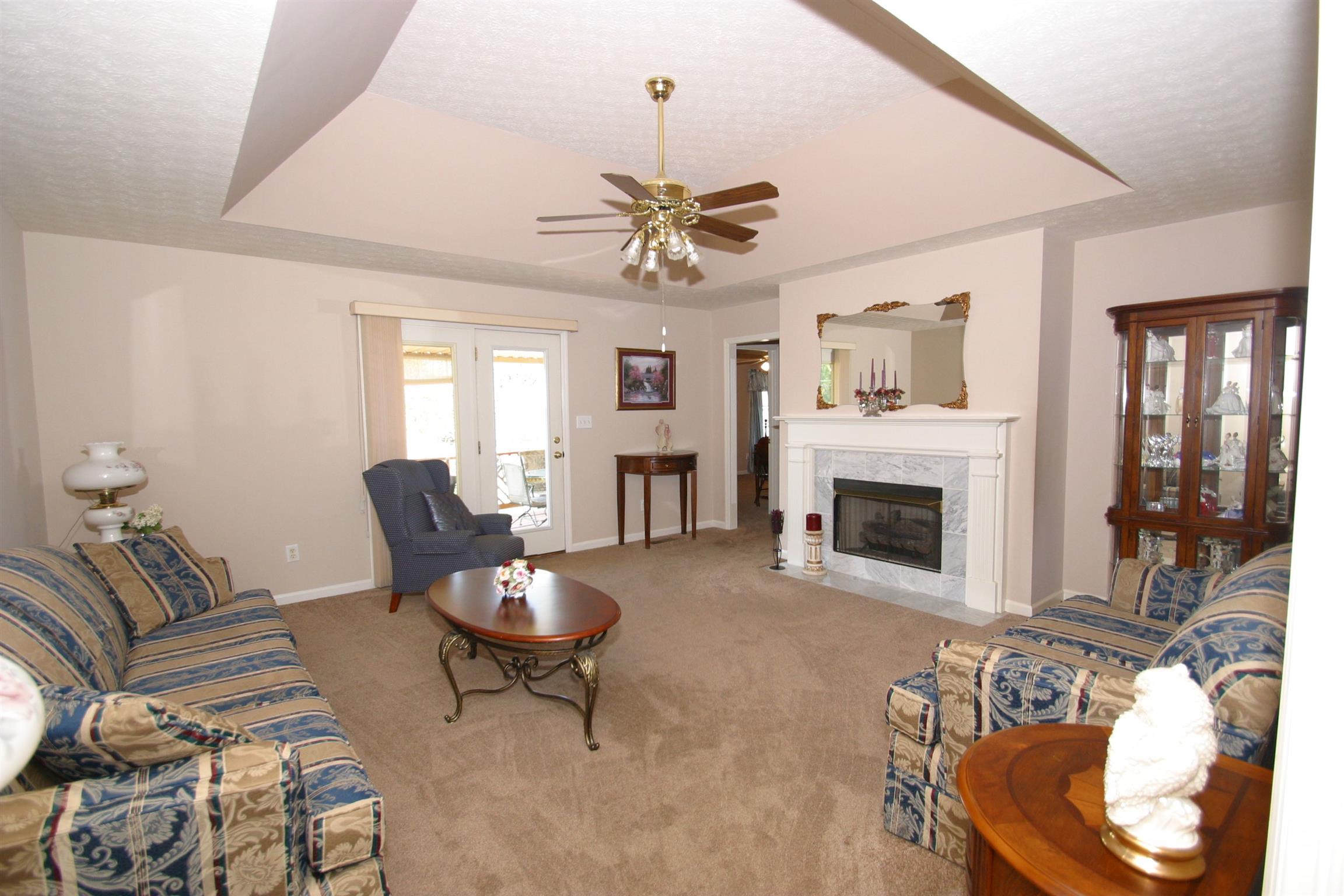 201 Putter Point Drive Gallatin, TN 37066 - Photo 9 of 24 Living Room W/ Tray Ceiling, Door leads to Covered Porch.