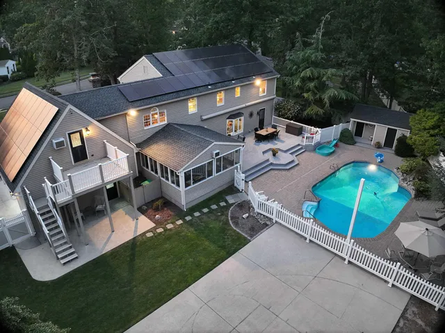 an aerial view of a house with a garden