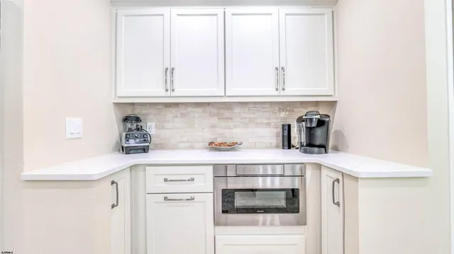 a living room with furniture a rug and a window