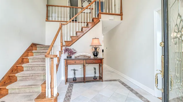 a bathroom with a granite countertop toilet sink and mirror