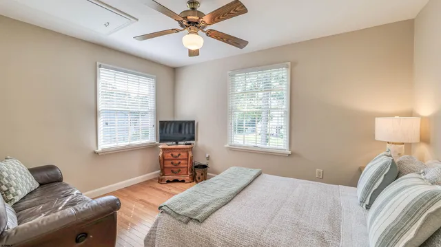 a view of walk in closet with clothes
