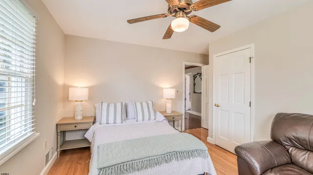 a view of hall way with furniture and a chandelier