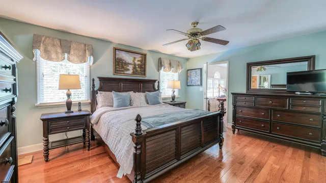 a view of a livingroom with furniture window and wooden floor