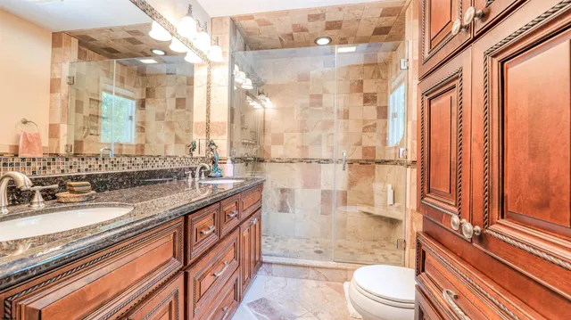 a balcony with wooden floor and fence