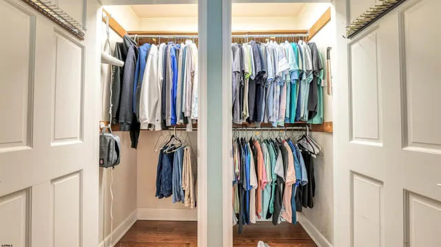 a room with pool table and windows
