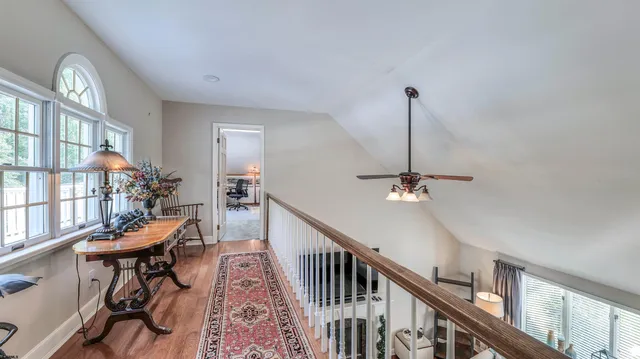 a bedroom with furniture and a lamp