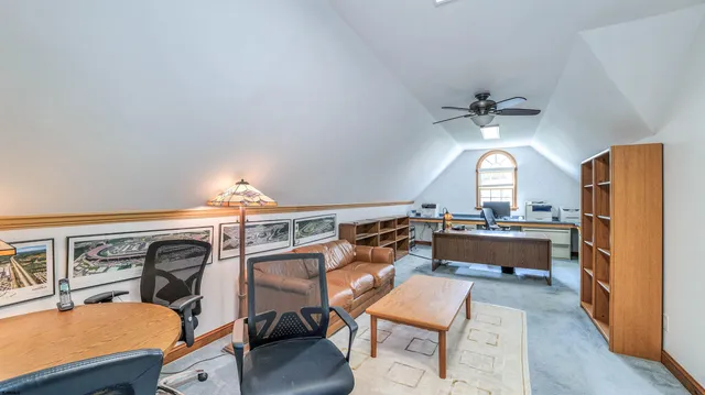 a front view of a house with outdoor seating