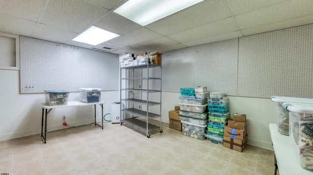 a view of an house with backyard space and tree