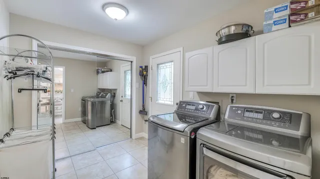 a view of a yard with plants and trees