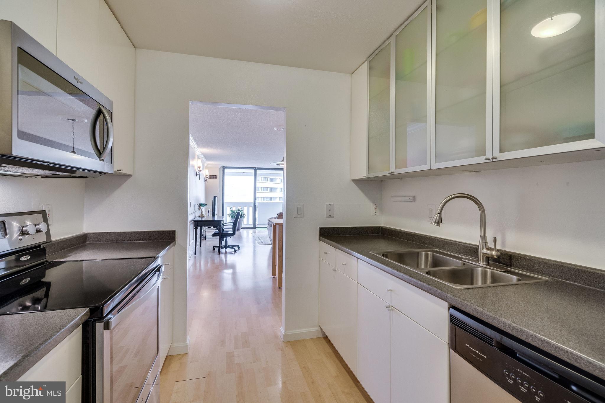 6101 Edsall Road, Unit 905 Alexandria, VA 22304 - Photo 26 of 62 a kitchen with stainless steel appliances granite countertop a sink a stove and cabinets