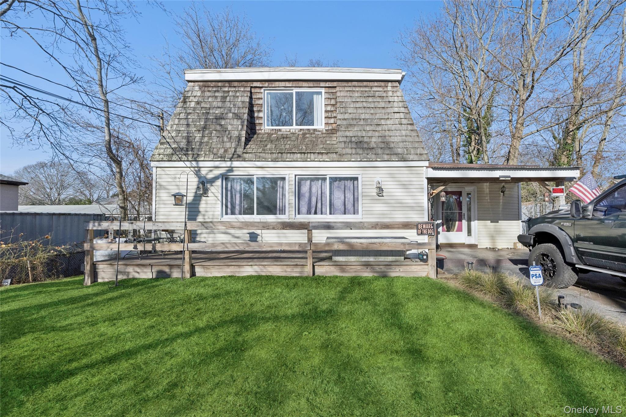 1363 Brick Kiln Road Sag Harbor, NY 11963 - Photo 11 of 13 a front view of a house with garden and sitting area