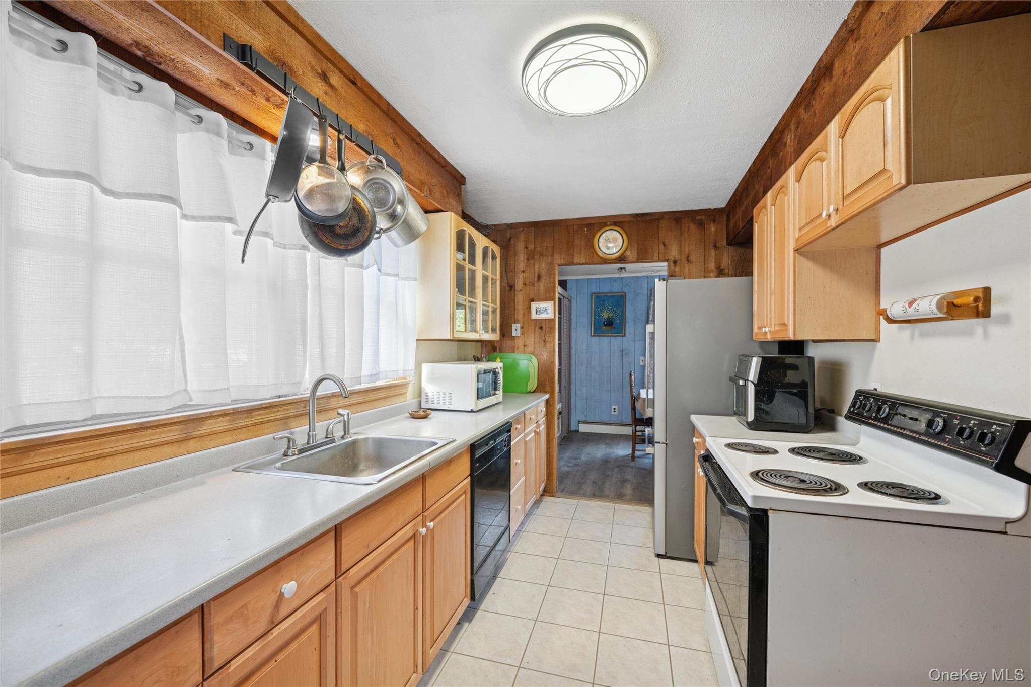 1363 Brick Kiln Road Sag Harbor, NY 11963 - Photo 3 of 13 a kitchen with a sink cabinets and stainless steel appliances