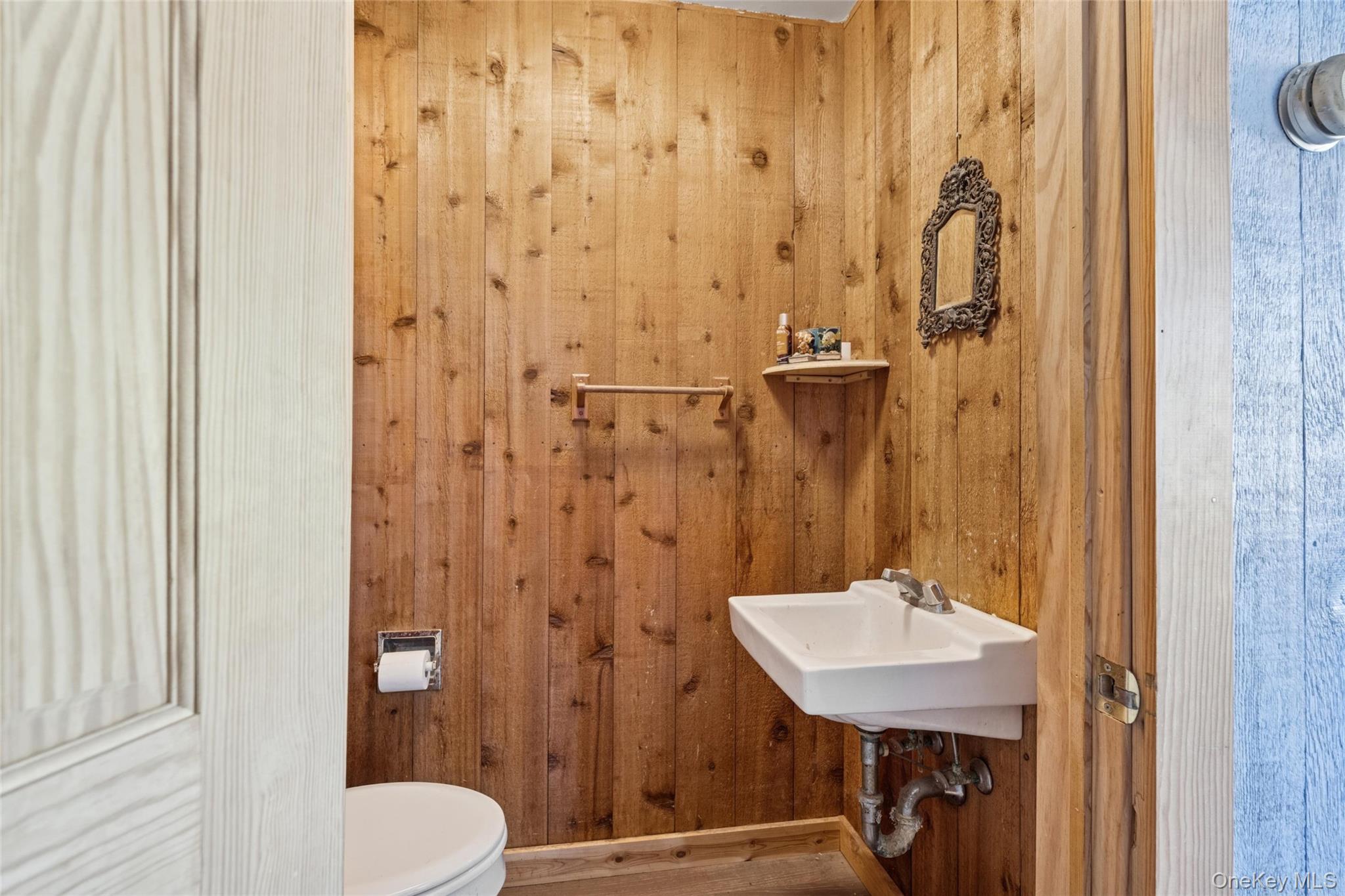 1363 Brick Kiln Road Sag Harbor, NY 11963 - Photo 6 of 13 a bathroom with a sink toilet and shower