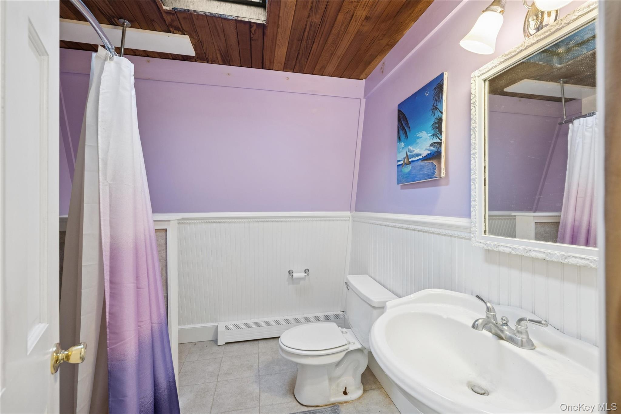 1363 Brick Kiln Road Sag Harbor, NY 11963 - Photo 7 of 13 a bathroom with a sink a toilet and shower curtain