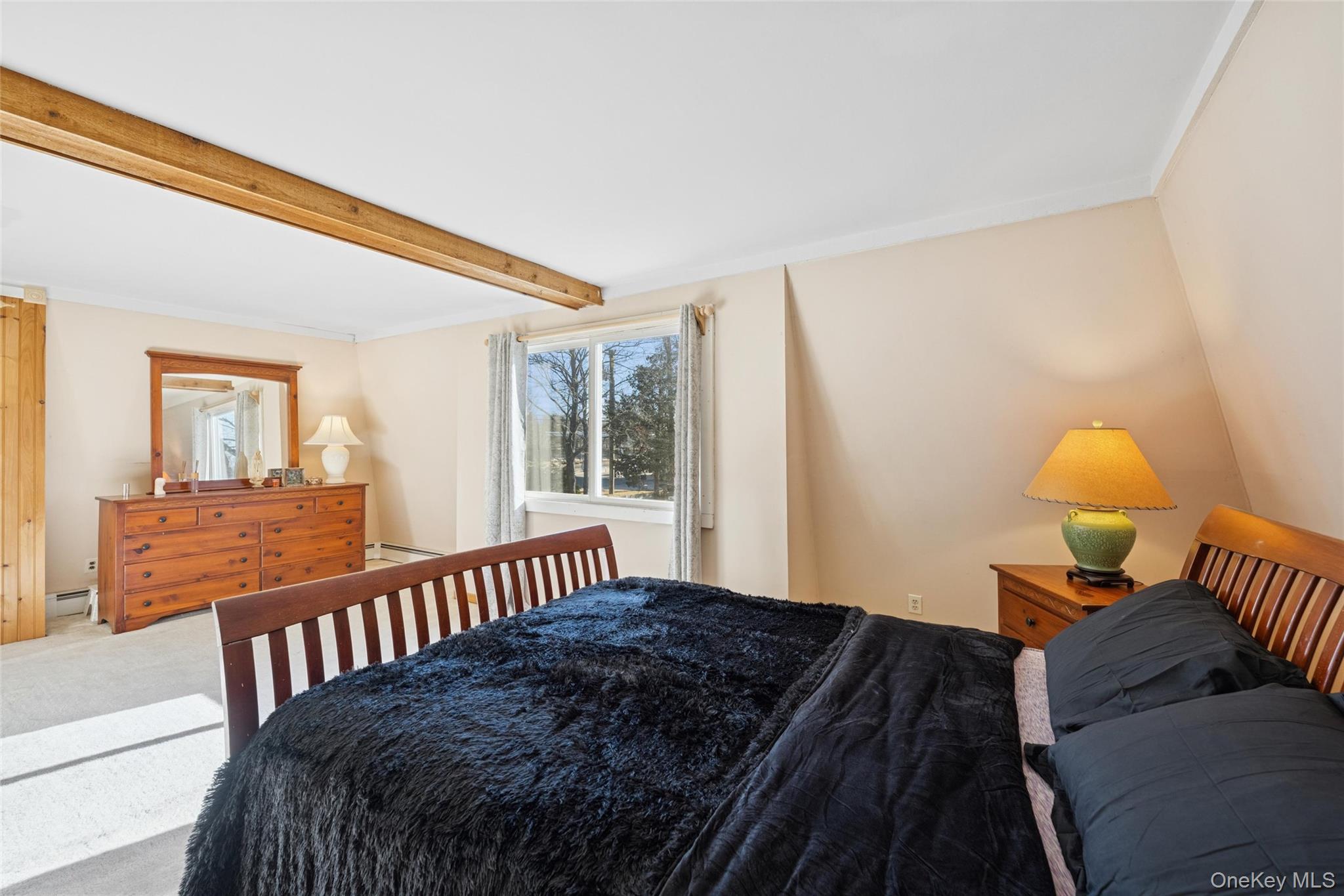 1363 Brick Kiln Road Sag Harbor, NY 11963 - Photo 8 of 13 a bedroom with bed and a window with outer view