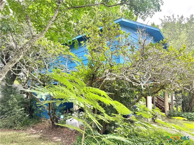 a backyard of a house with lots of green space