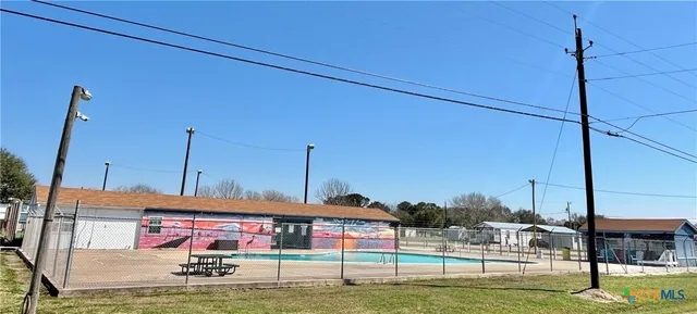 a view of a lake with houses in the background