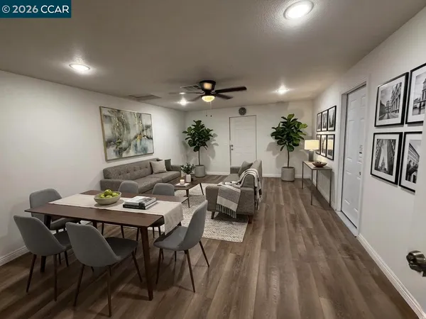 a view of a dining room with furniture window and wooden floor