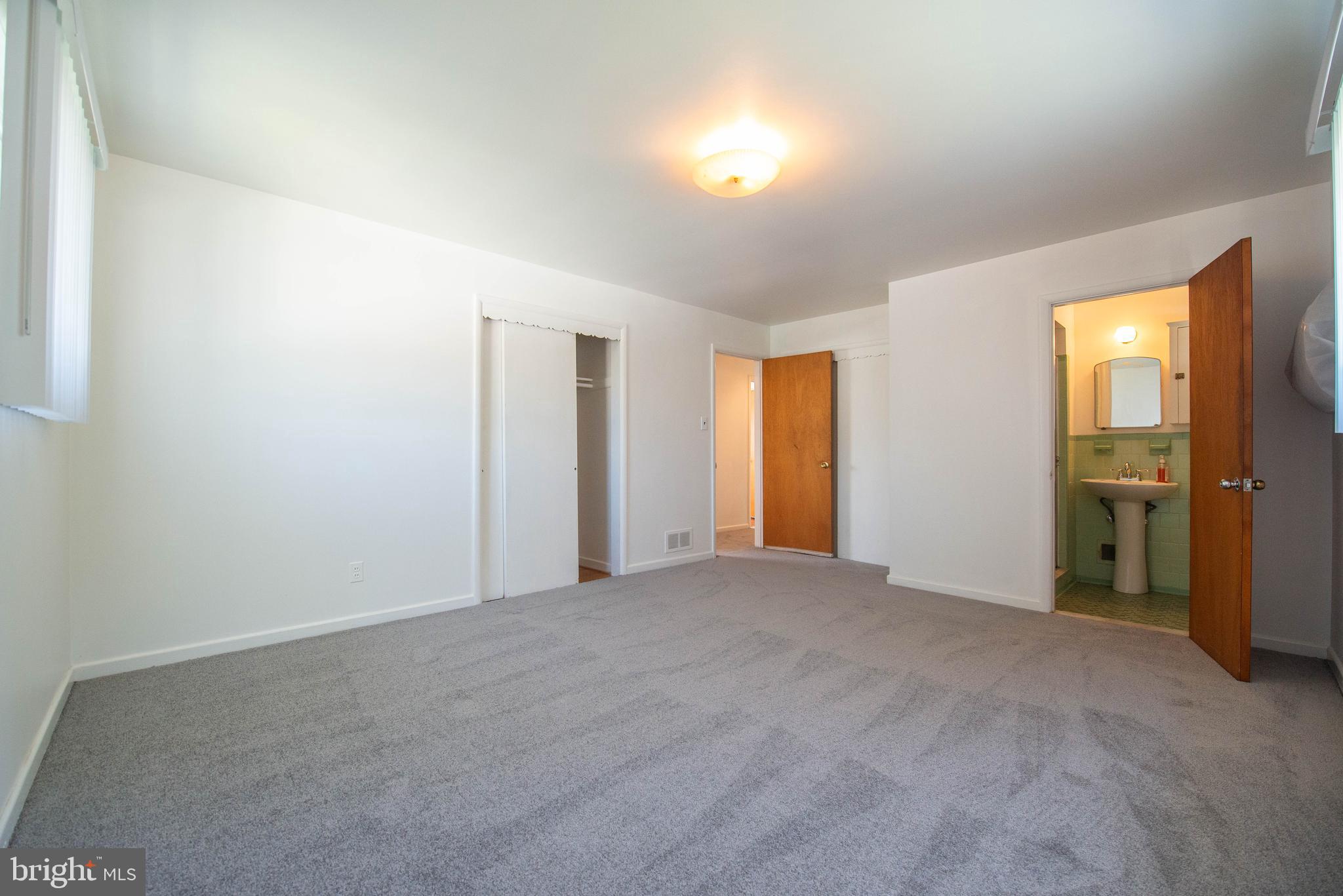 7408 Shirley Road Baltimore, MD 21207 - Photo 11 of 25 a view of empty room with windows