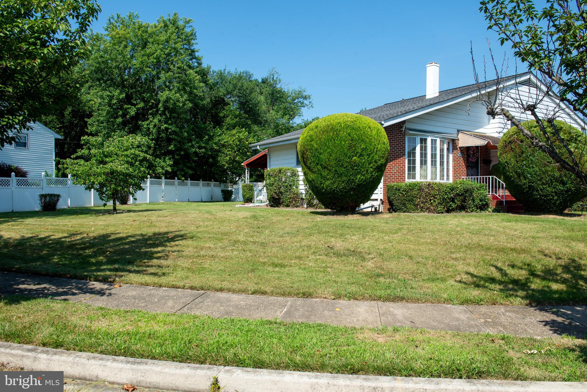 7408 Shirley Road Baltimore, MD 21207 - Photo 18 of 25 a view of a house with a yard