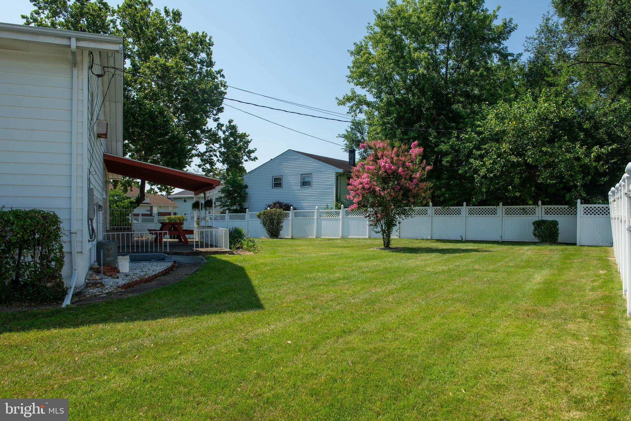 7408 Shirley Road Baltimore, MD 21207 - Photo 21 of 25 a view of a house with backyard and a tree