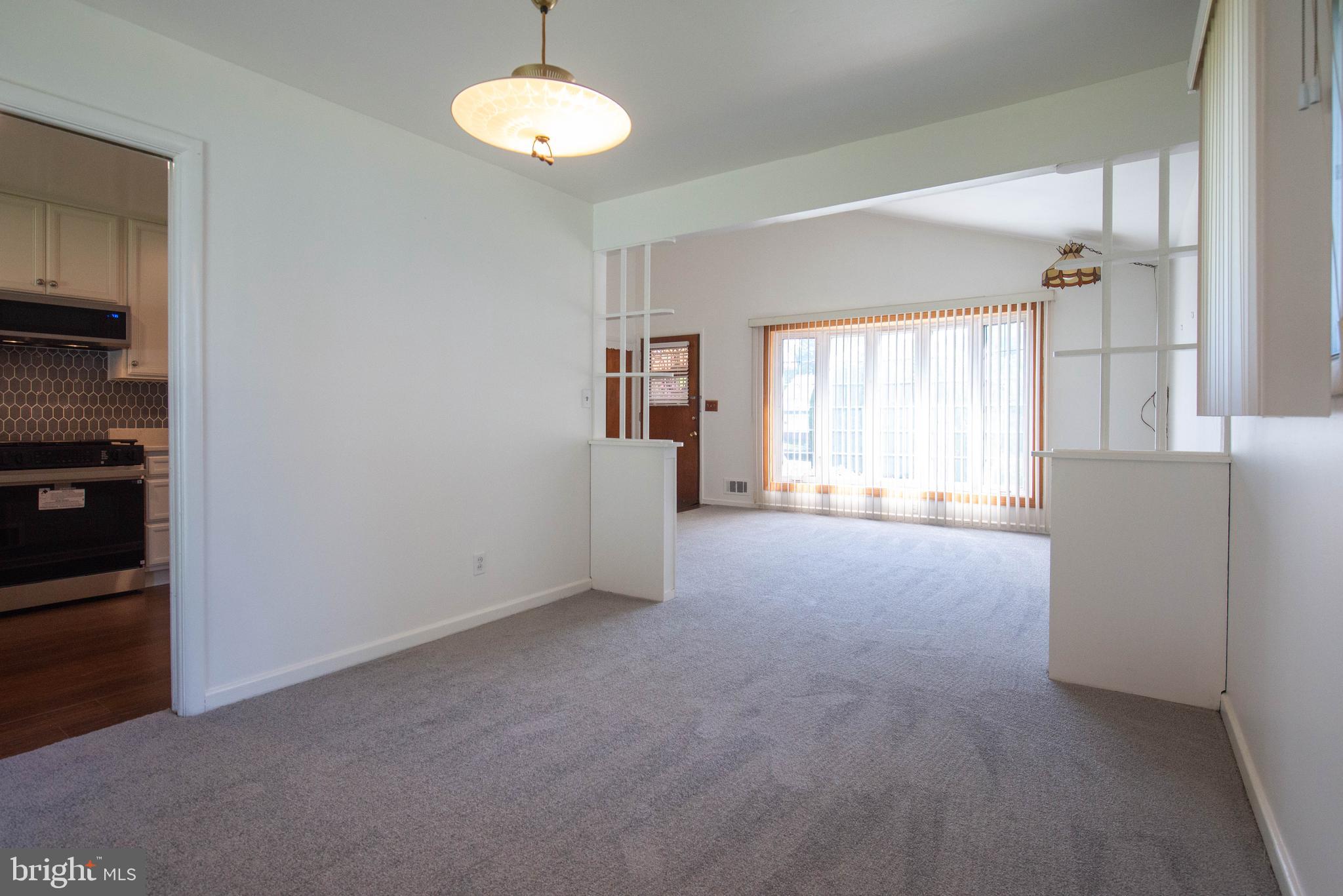 7408 Shirley Road Baltimore, MD 21207 - Photo 4 of 25 a view of a livingroom with a window