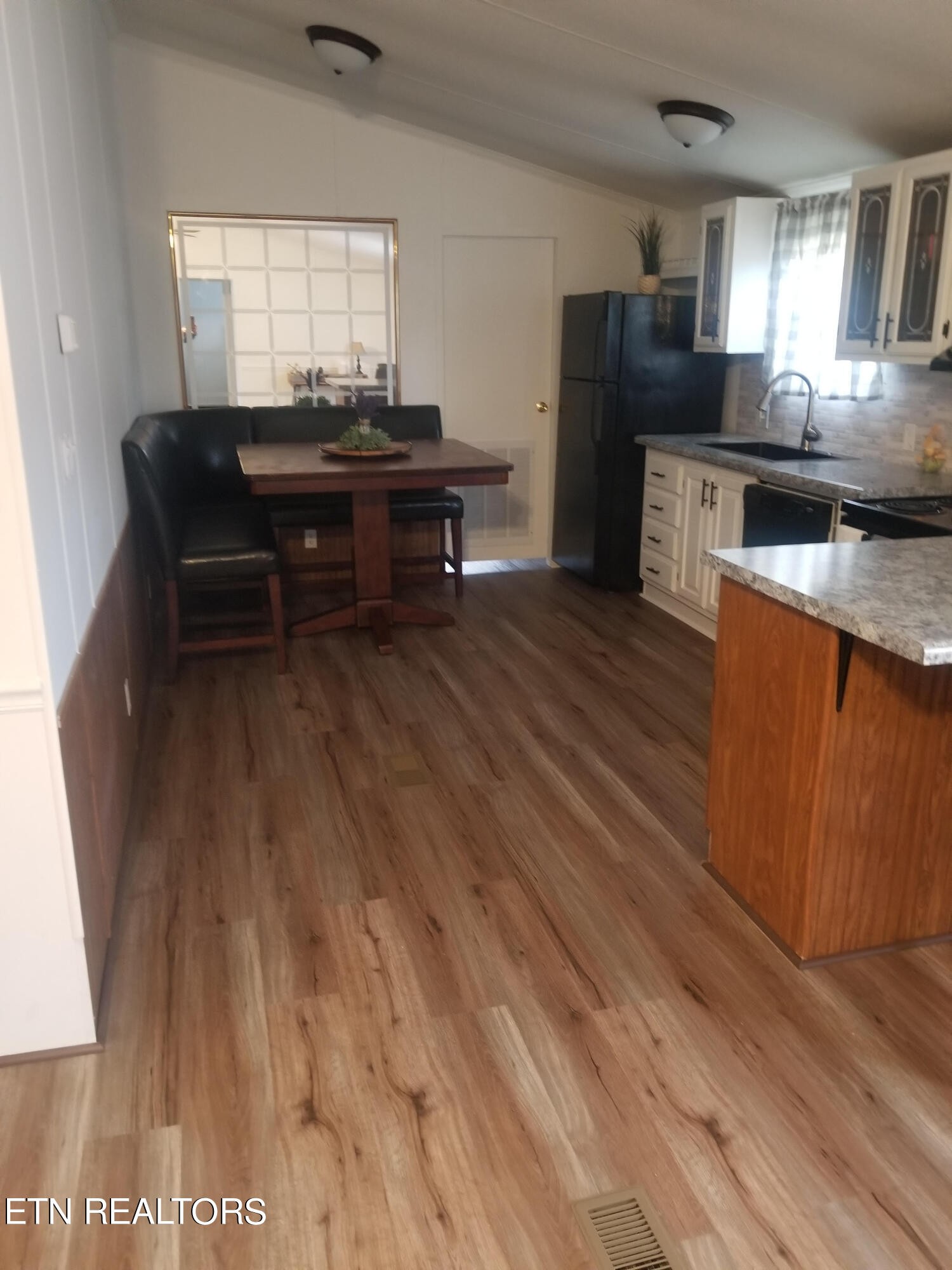 345 Fiske Road Harriman, TN 37748 - Photo 4 of 12 a view of kitchen with cabinets and wooden floor