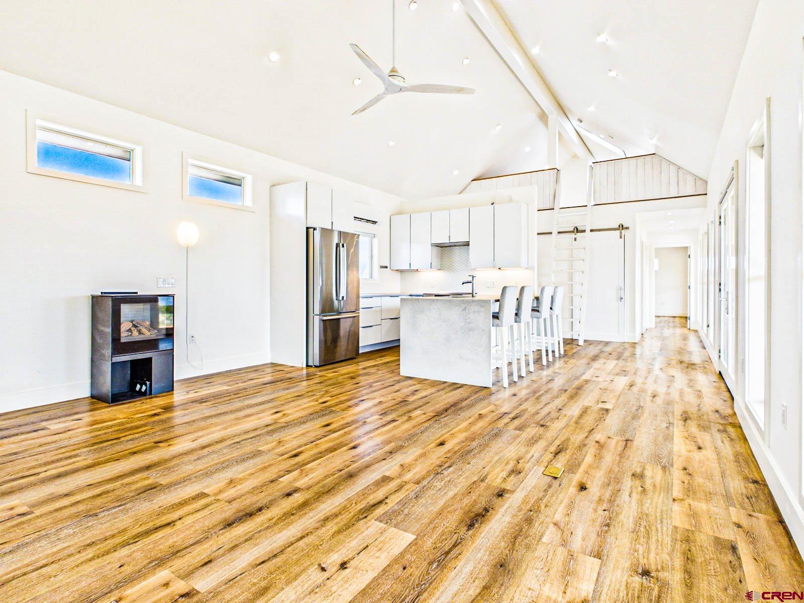 3530 Black Canyon Road Crawford, CO 81415 - Photo 13 of 45 a view of kitchen with furniture and wooden floor