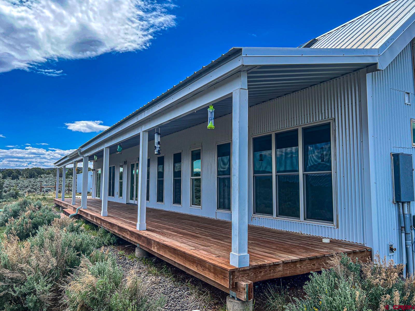 3530 Black Canyon Road Crawford, CO 81415 - Photo 27 of 45 a front view of a house with a porch