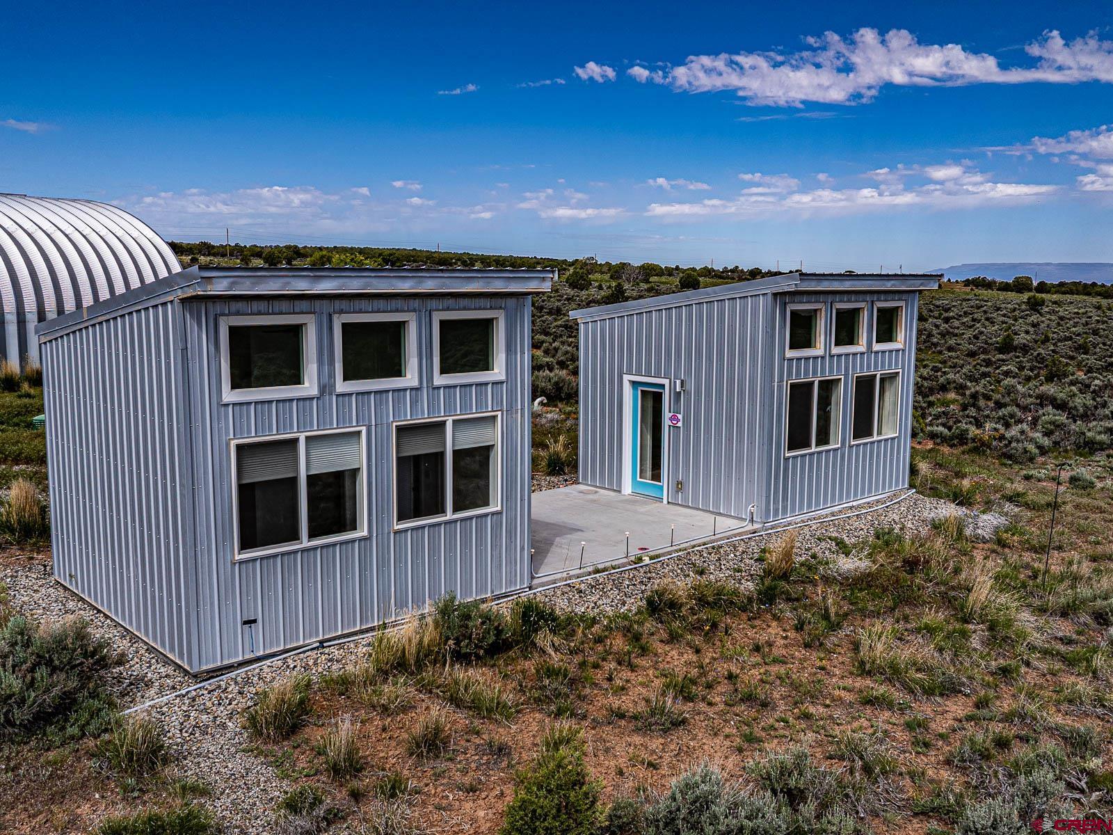 3530 Black Canyon Road Crawford, CO 81415 - Photo 31 of 45 a view of a house with a backyard