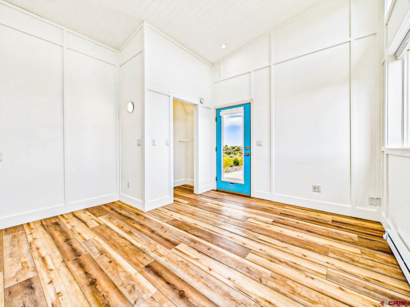 3530 Black Canyon Road Crawford, CO 81415 - Photo 35 of 45 a view of an empty room with wooden floor