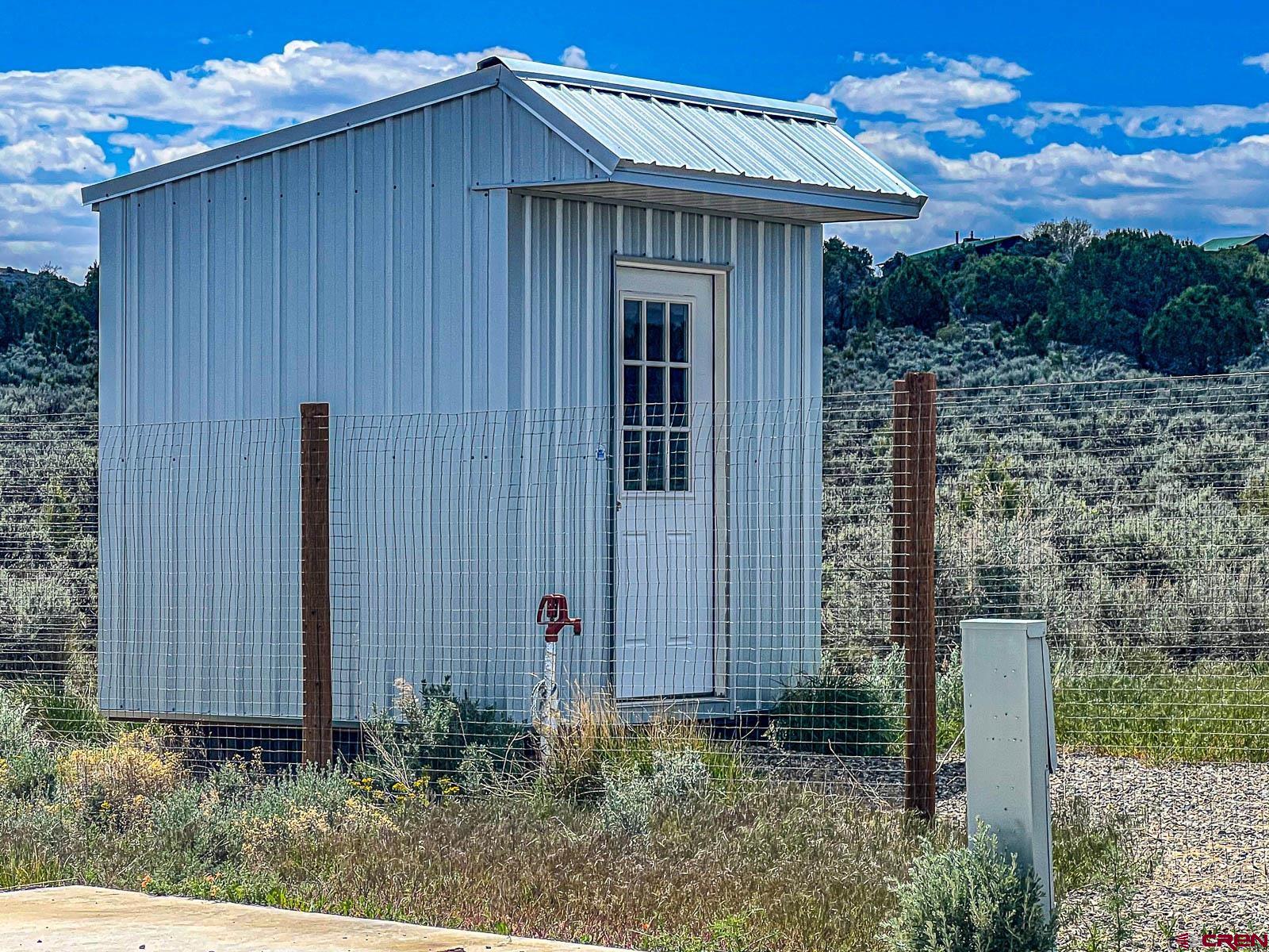 3530 Black Canyon Road Crawford, CO 81415 - Photo 40 of 45 a view of a house with backyard and garden