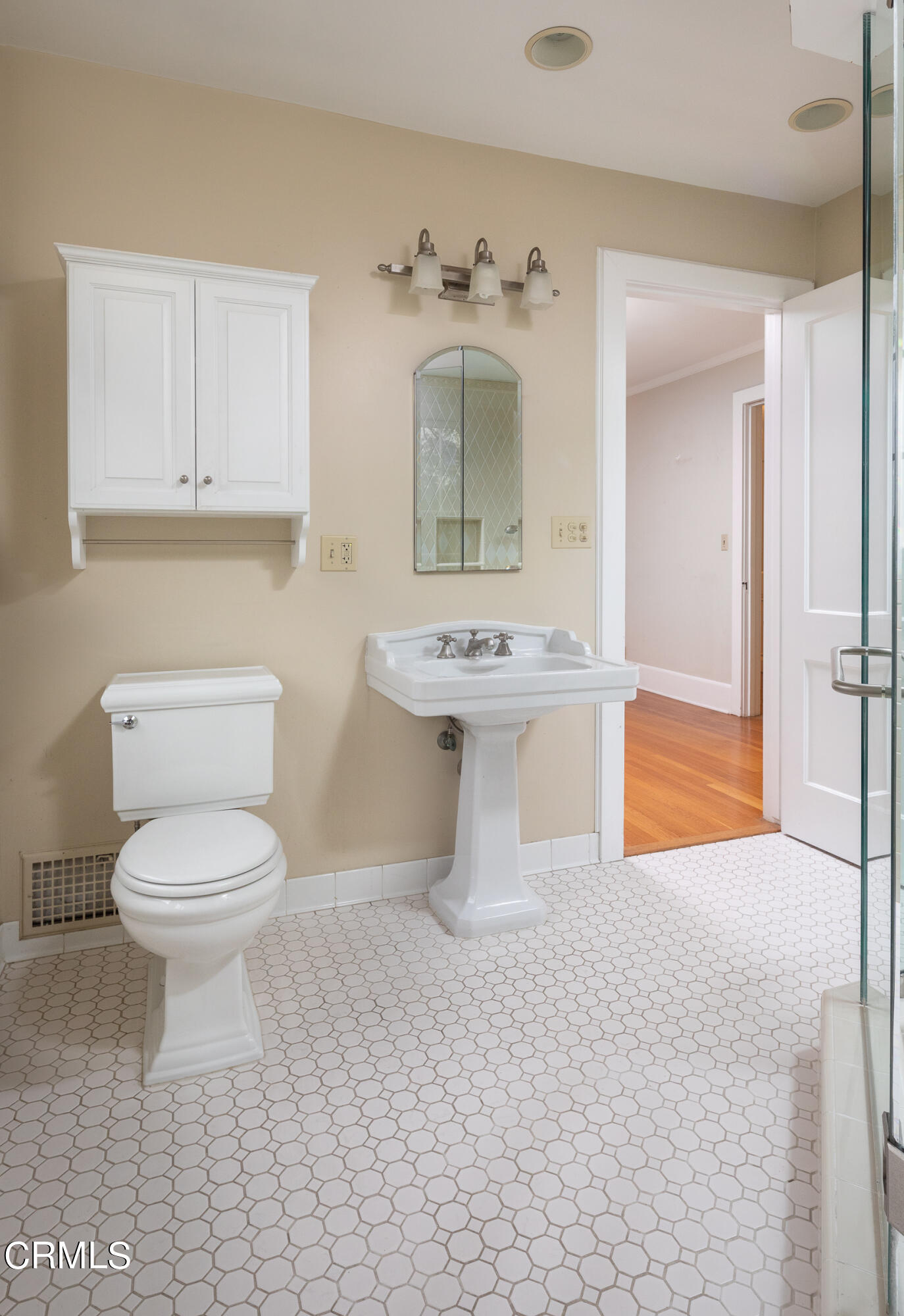 1973 Mendocino Lane Altadena, CA 91001 - Photo 31 of 57 a bathroom with a toilet a sink and mirror