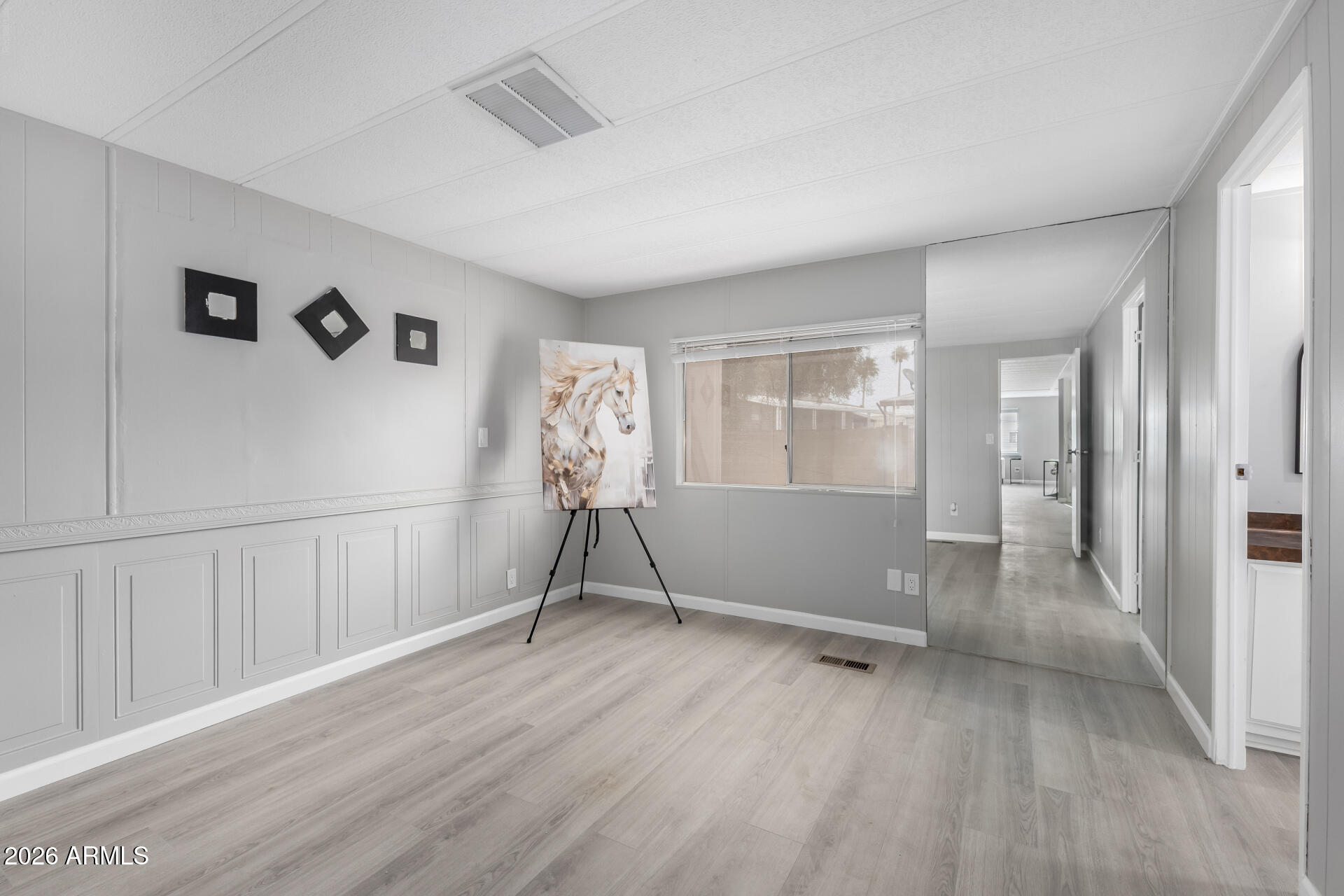 3104 East Broadway Road, Unit 30 Mesa, AZ 85204 - Photo 13 of 28 a view of an empty room with a window